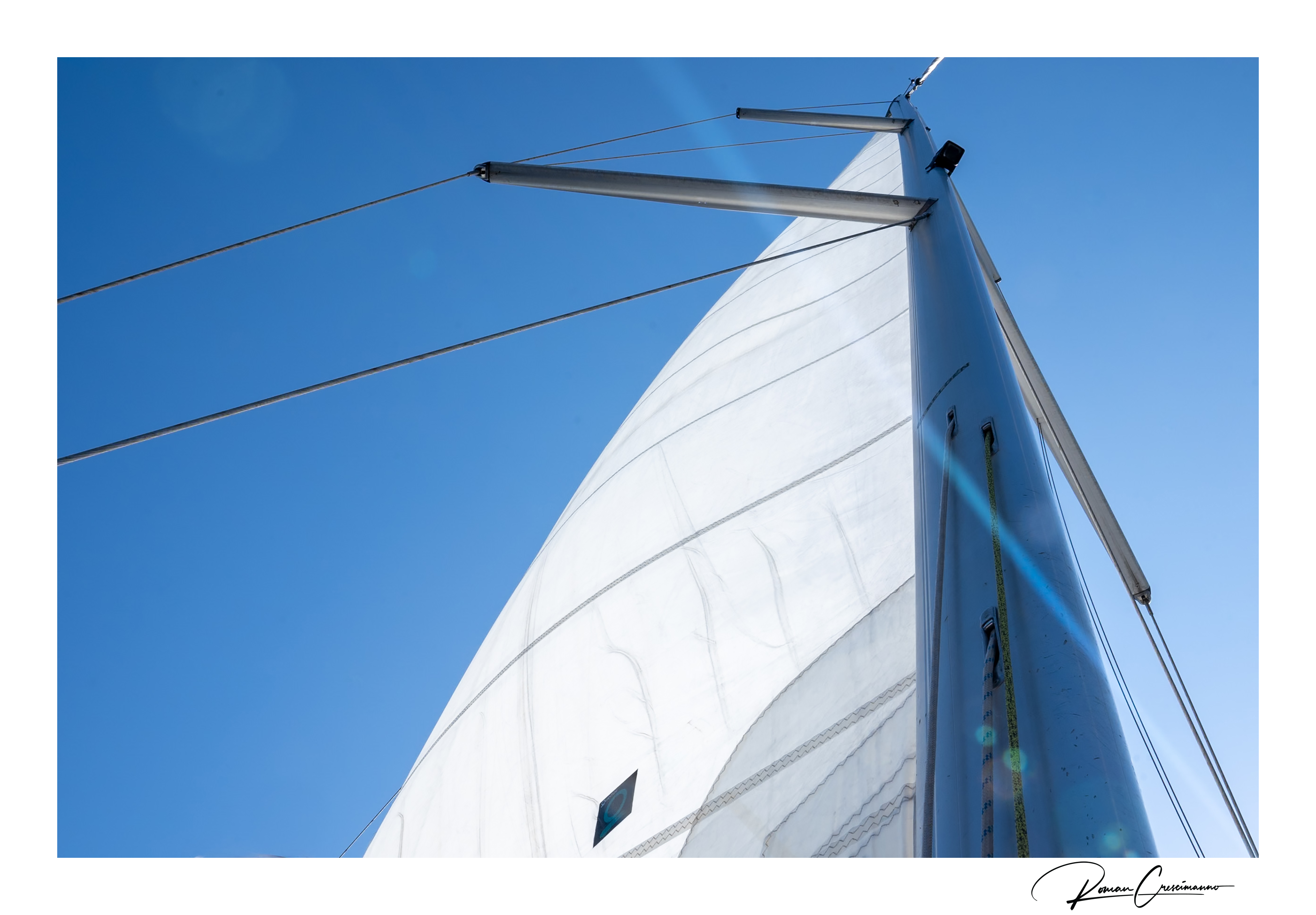 sail of sailboat photograph with boarder and digital signature